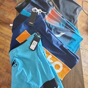 4 pack oakley board shorts/bathing suits, NWT, SZ 33, and Med.